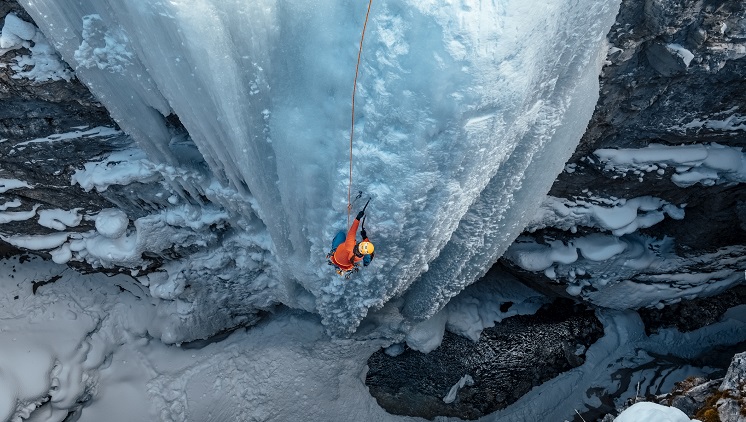 woman-climbing-frozen-waterfall-746-419.jpg